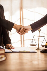 A lawyer and a client shaking hands, representing the trust people from Fort Lauderdale have in The Russo Firm as their Fort Lauderdale bicycle accident lawyer.