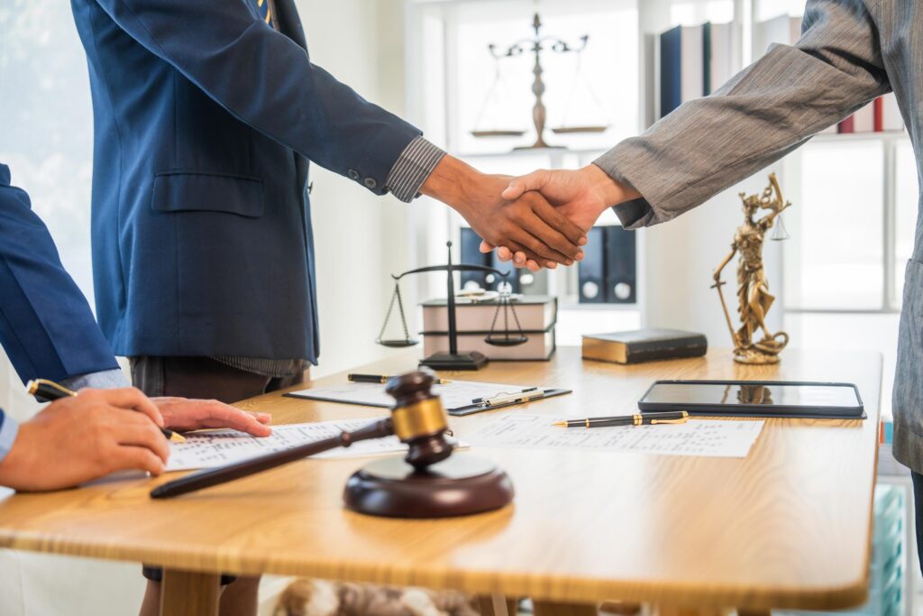 Florida mass tort lawyer shaking hands with a client to act as their personal advocate.