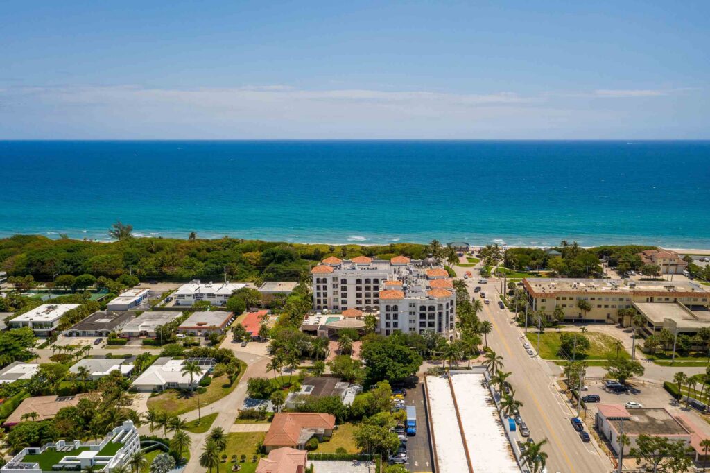 An aerial view of coastal Boca Raton buildings and roads next to the ocean, showing the geographic service area for Boca Raton Ride Share Accident Lawyers.