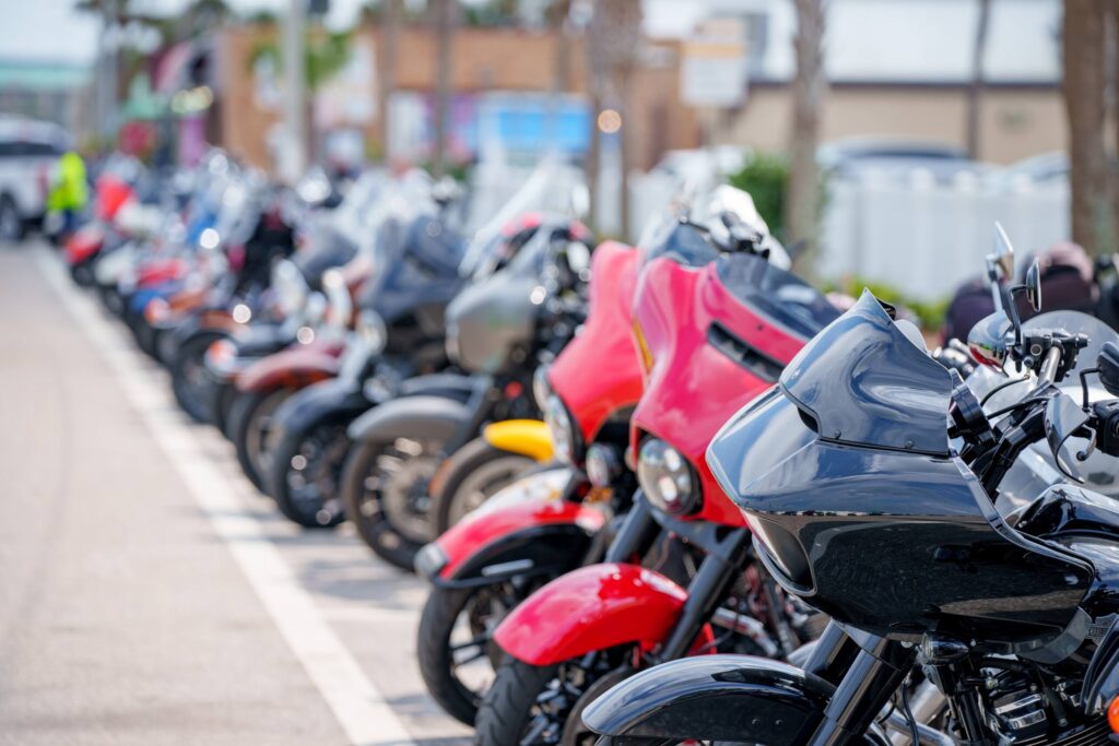 A row of motorcycles parked along a street, illustrating vehicle visibility issues related to the "I didn't see the motorcycle" defense in Boca Raton.
