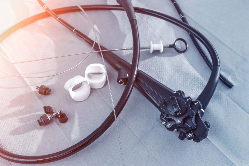 Medical endoscope equipment and components on a sterile surface, illustrating cases represented by Olympus Scopes Lawsuit Lawyers.